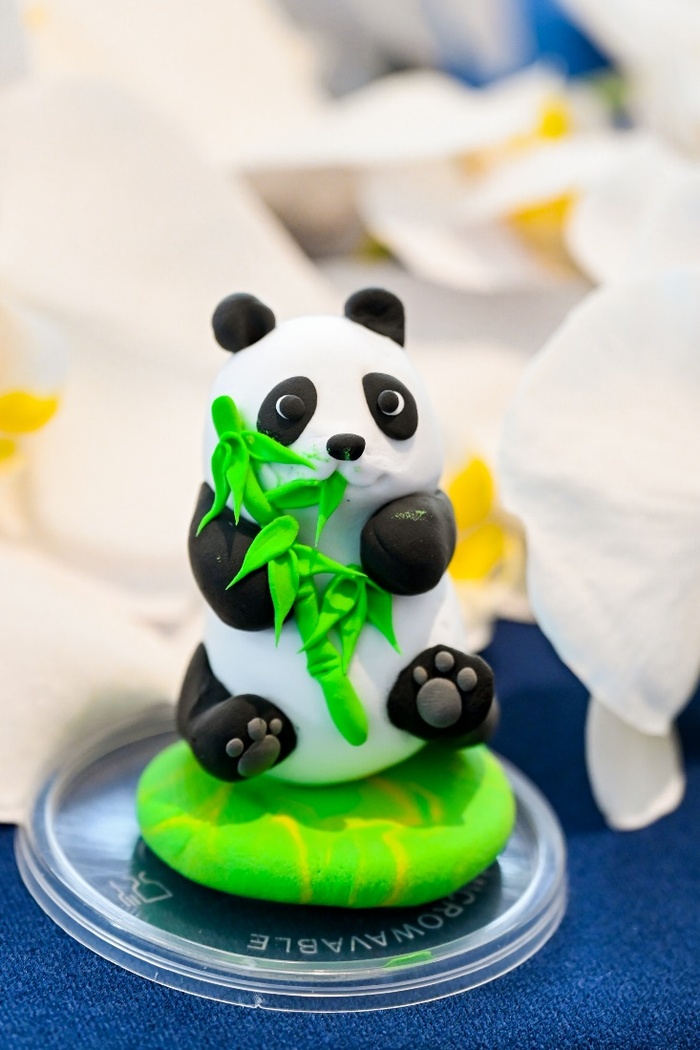 A picture containing birthday cake, dessert, sweetness, cake decorating Description automatically generated